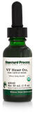 Image of a bottle of liquid VF Hemp Oil from Standard Process Veterinary Formulas next to a dropper that is included with the bottle.